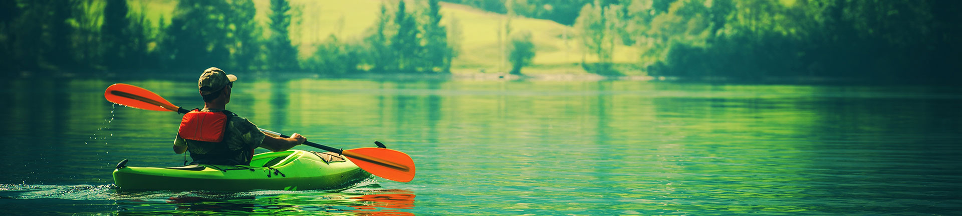man relaxing paddling on water