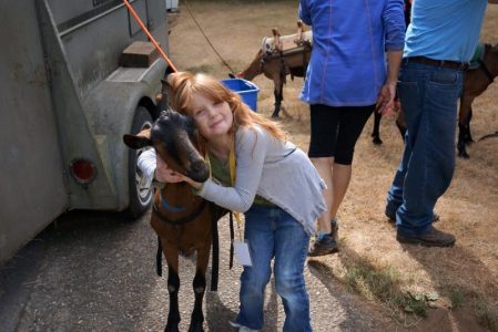 Camp-Eyabsut girl hugging goat