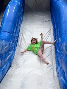 Camp-Eyabsut girl on slide