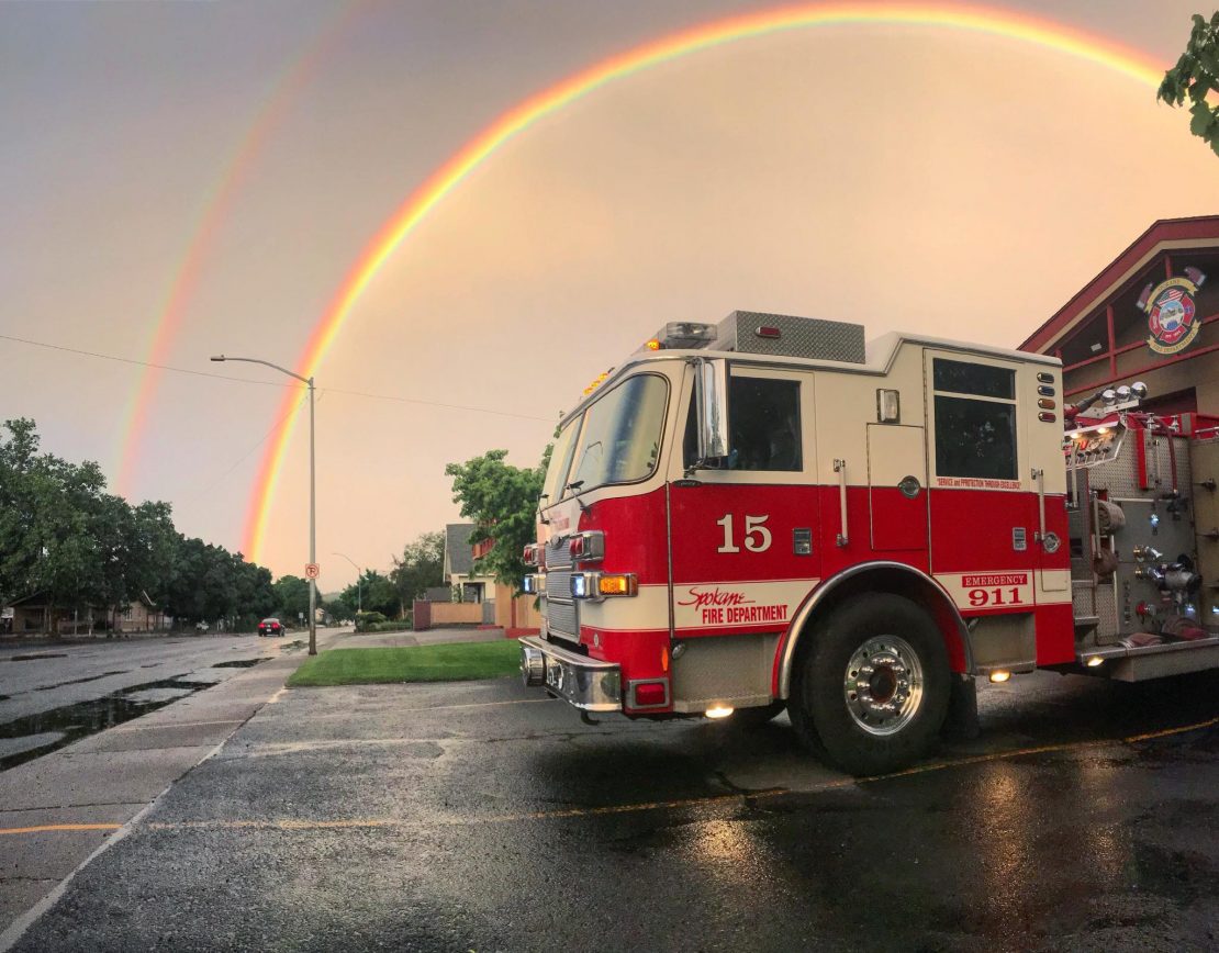 Spokane Fire Truck Parked under a rainbow